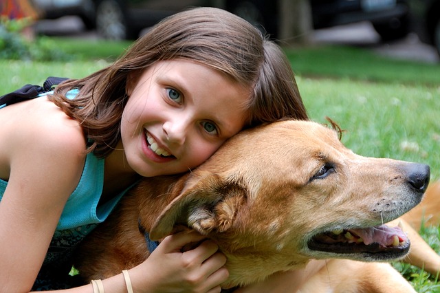 girl bonding with dog